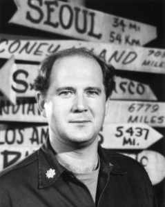 David Ogden Stiers as Major Charles Emerson Winchester III, standing before many different directions.